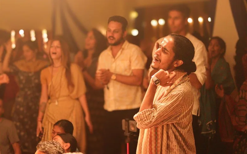 A voice rising in the middle of the kirtan