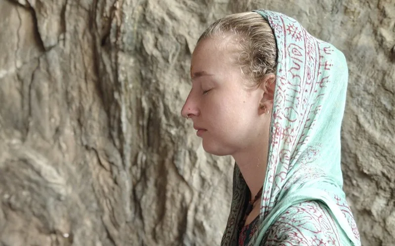 Quiet japa meditation on a strand of beads