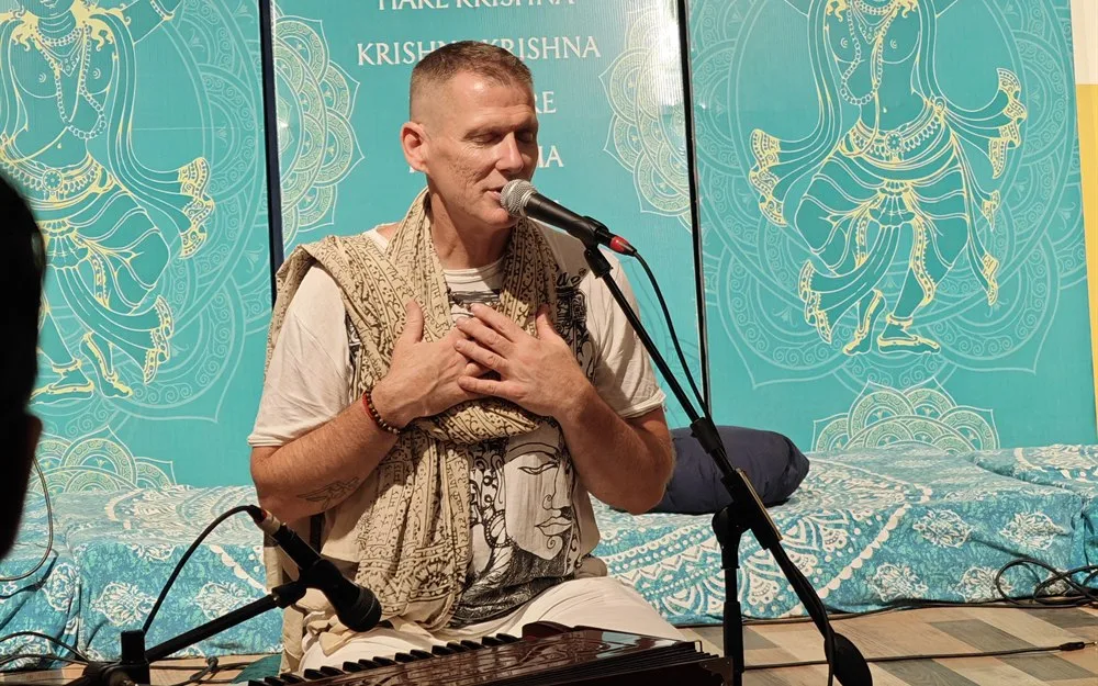 Recording a talk in front of the kirtan backdrop