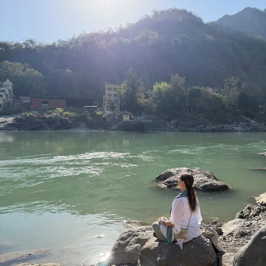 Quiet meditation on a rock by the Ganga