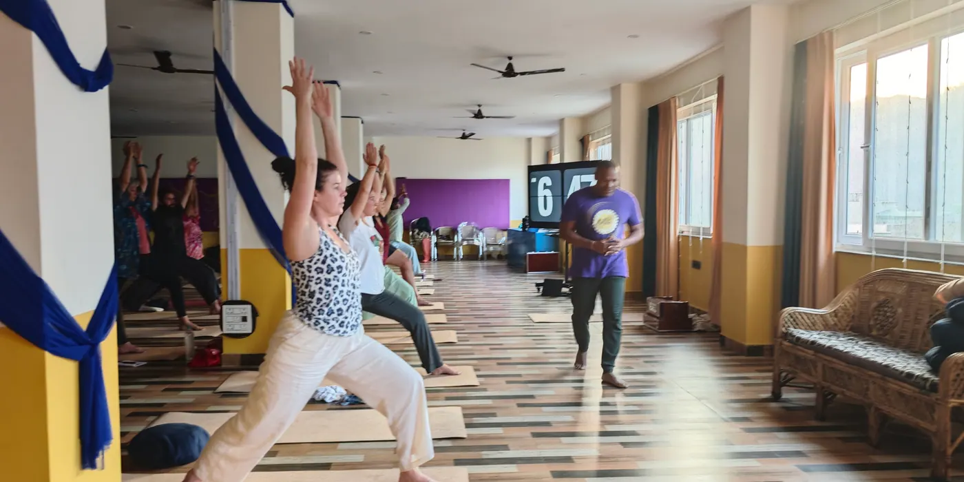 Morning yoga class in the ashram hall