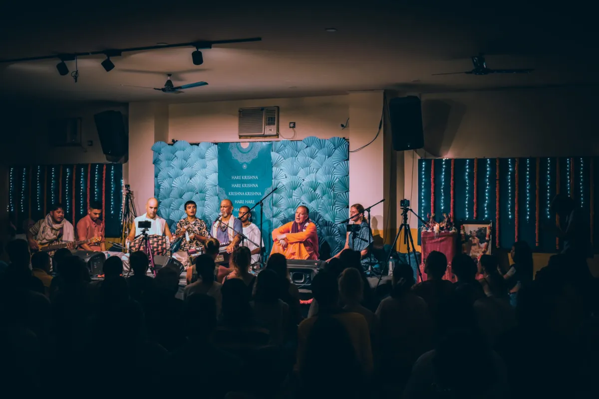 Kirtan singers on stage at a Kirtan Mela evening